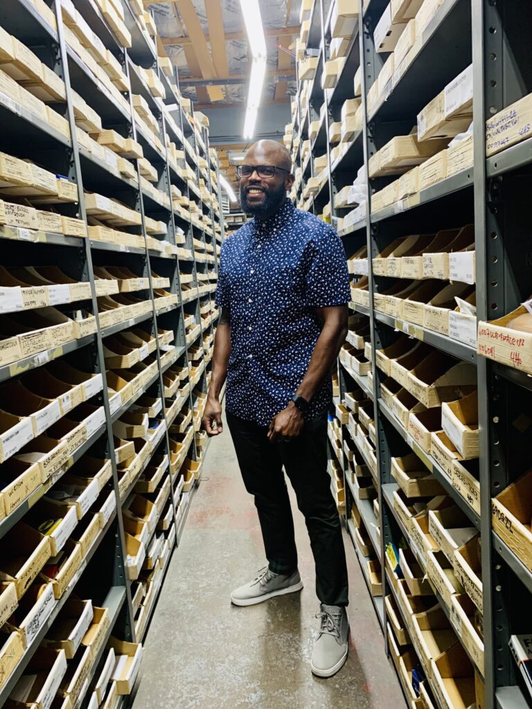 The picture shows Lenny Brookes, sales engineer, in the Alpine Bearing warehouse.