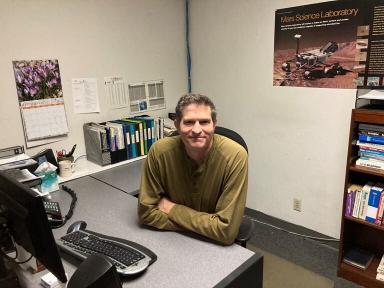 The picture shows William Pool at his desk at Alpine Bearing in Anaheim, California.