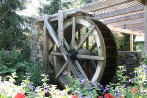 The picture shows a wooden water wheel.