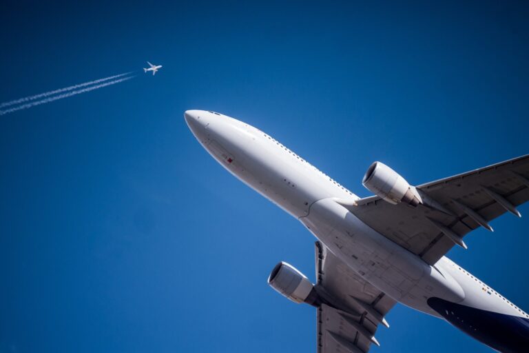 An airplane flying overhead, full of aircraft needle and roller bearings.