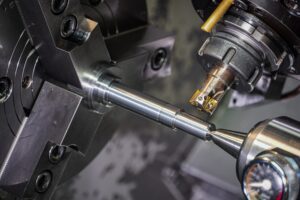 What causes bearing failures? CNC machining of a metal shaft.