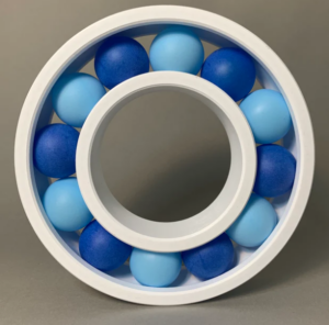 The picture shows a large novelty bearing full of ping-pong balls to represent unusual bearings.
